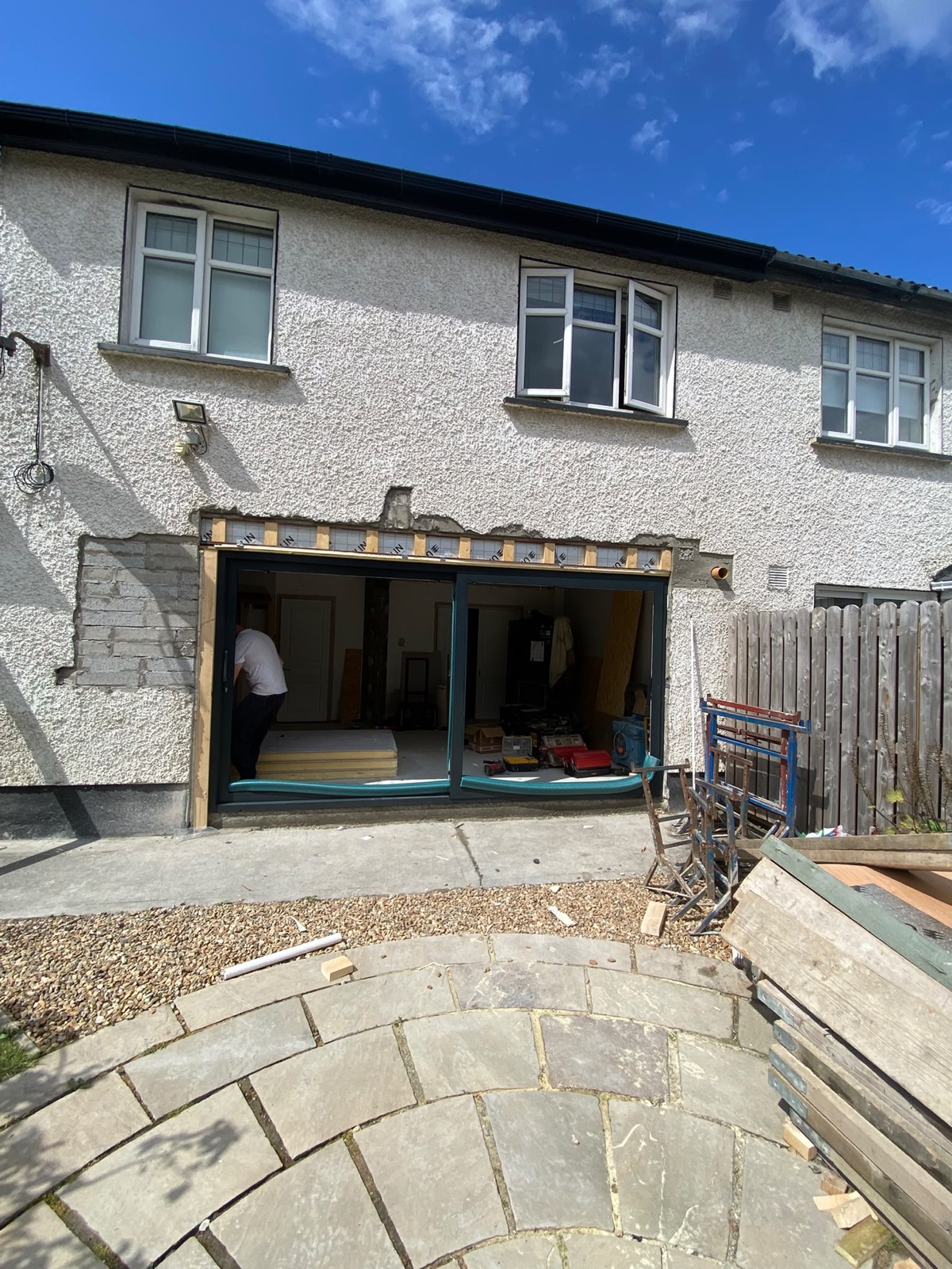 Rear wall opening prepared for a large sliding door installation in Ashbourne.
